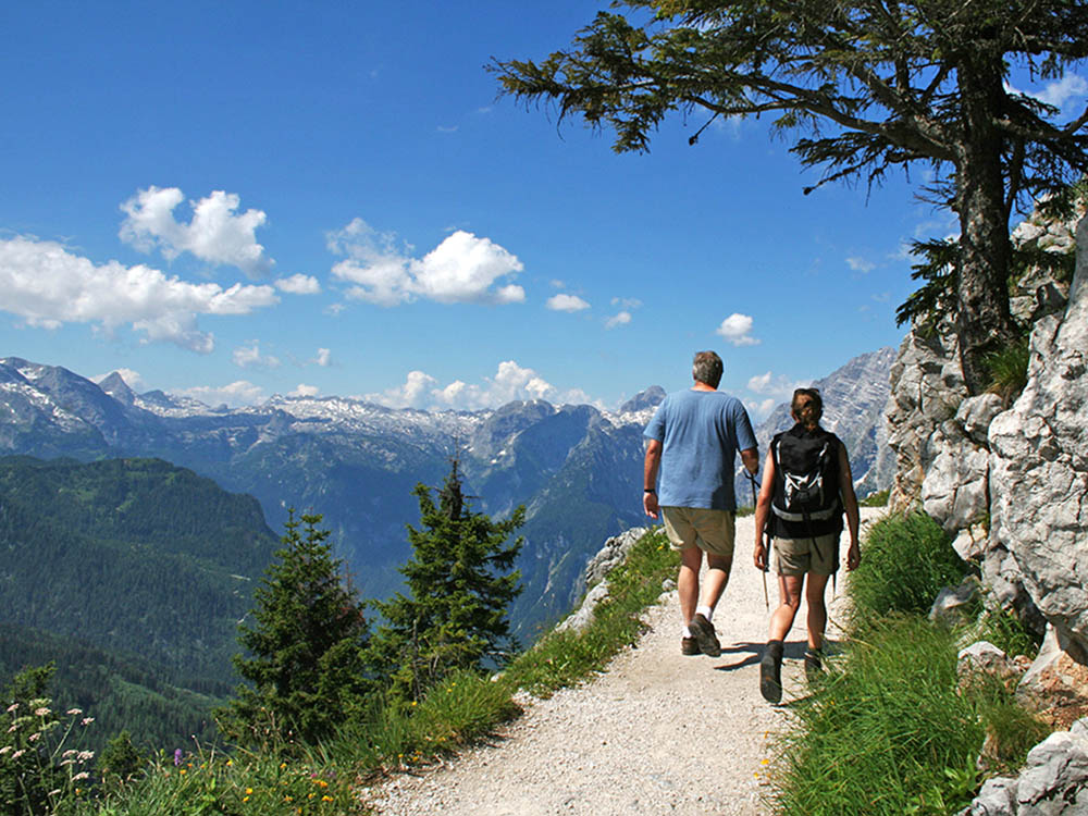 Woman Hiking On Mountain Trail by Frank Huster